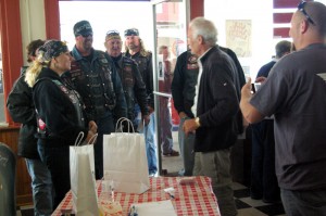 bikers dropping in to draw cards during the fundraising Poker Run